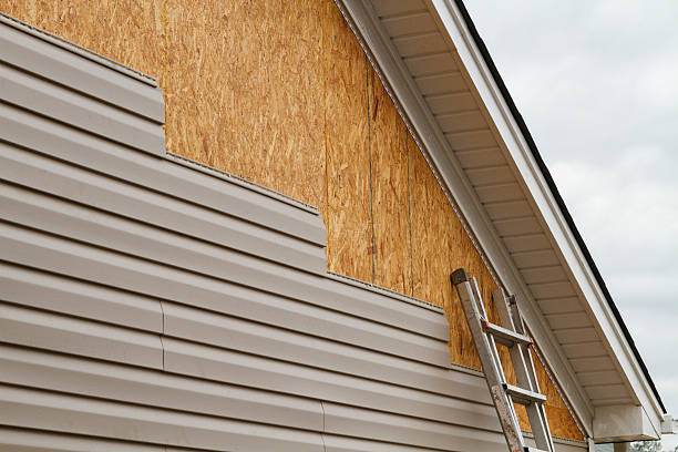 Professional Siding Replacement technician working in Midland, WA